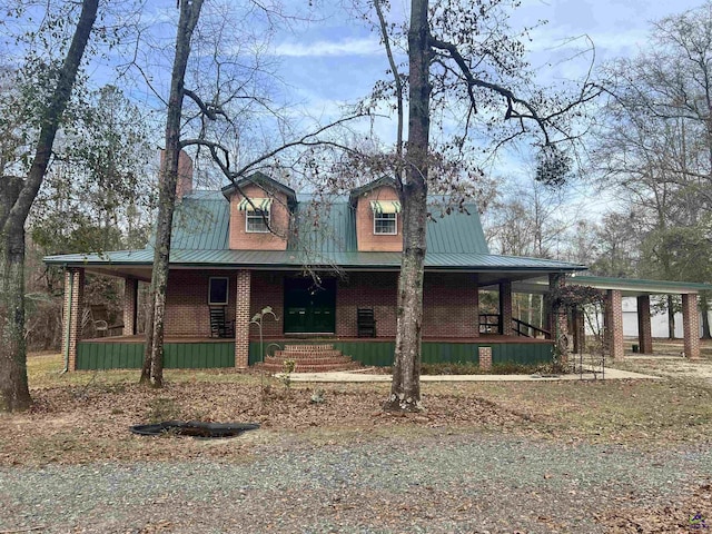 2382 Gallimore Mill Rd, Jeffersonville, GA 31044 - view of front of home with covered porch, brick siding, and a metal roof