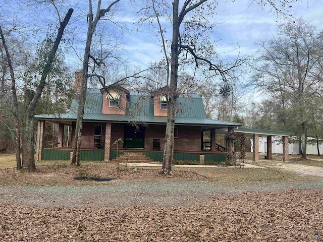 2382 Gallimore Mill Rd, Jeffersonville, GA 31044 - view of front of property with a porch, a metal roof, and a carport