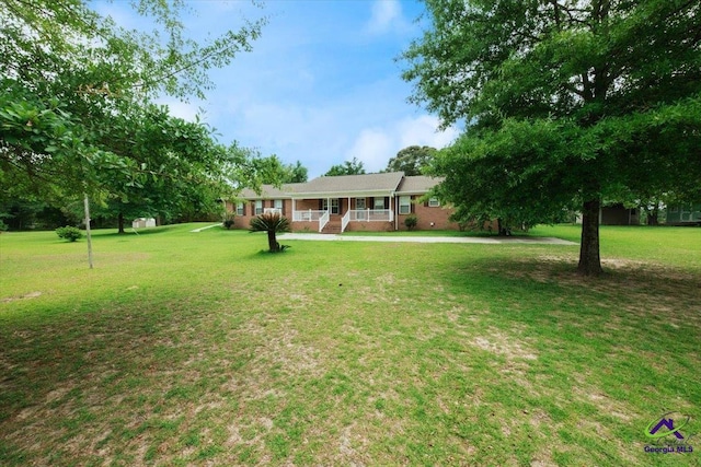 view of front of home featuring a front lawn and a porch