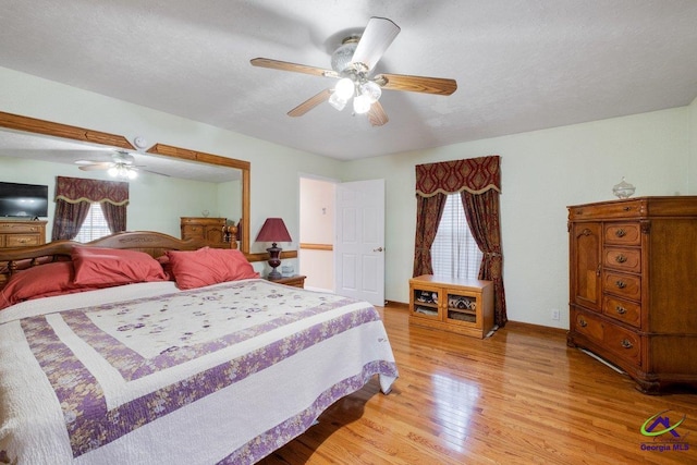 bedroom featuring light hardwood / wood-style flooring and ceiling fan