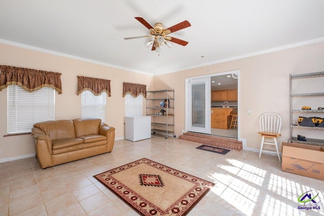 tiled living room with ceiling fan and crown molding