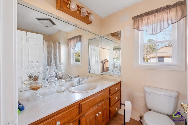 bathroom with a shower with curtain, vanity, and toilet