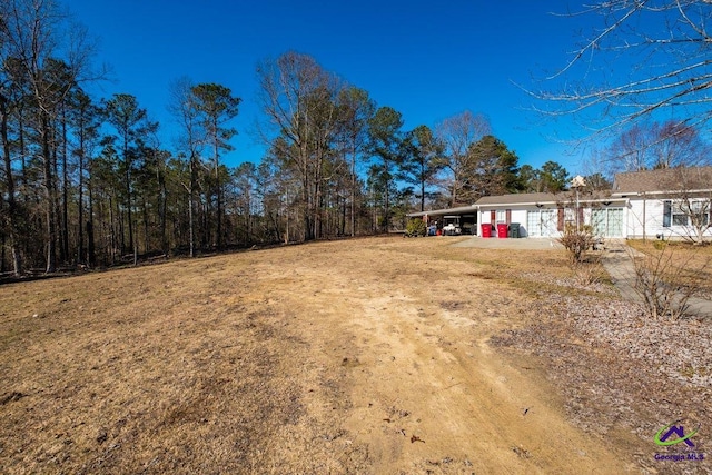 view of yard with a carport