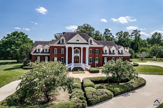 neoclassical / greek revival house with a front yard