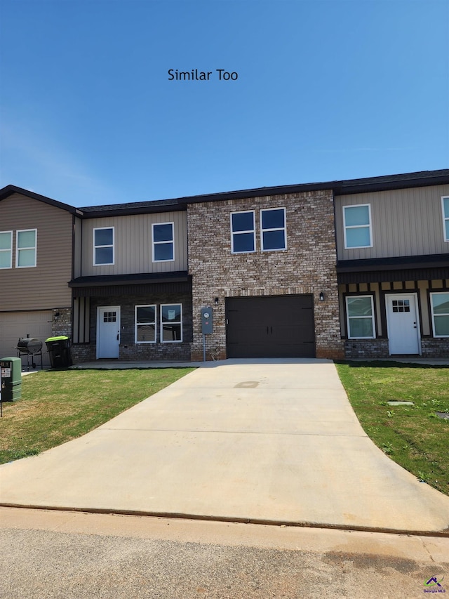 view of front facade featuring a garage and a front lawn