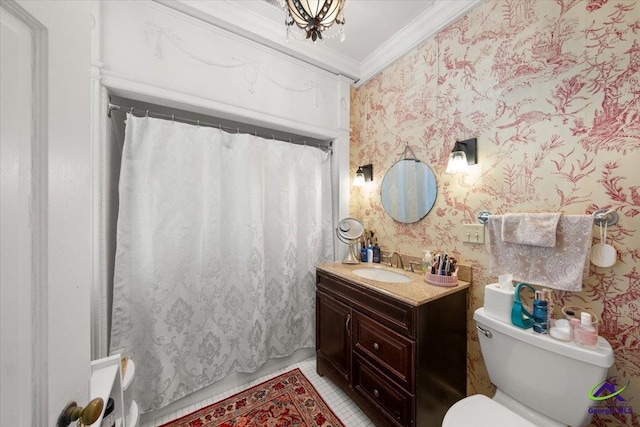 bathroom featuring toilet, vanity with extensive cabinet space, an inviting chandelier, and crown molding