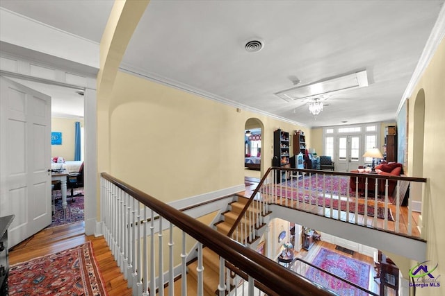 hall featuring crown molding and light wood-type flooring