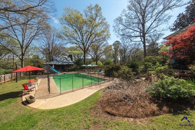 view of swimming pool with a patio area and a yard