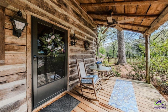 wooden terrace with ceiling fan