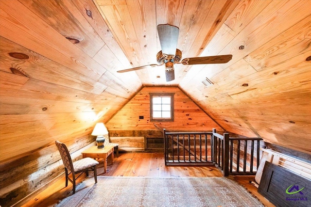 bonus room featuring lofted ceiling, hardwood / wood-style floors, ceiling fan, and wood ceiling