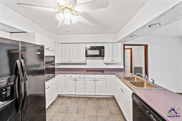 kitchen with ceiling fan, white cabinetry, black appliances, and sink