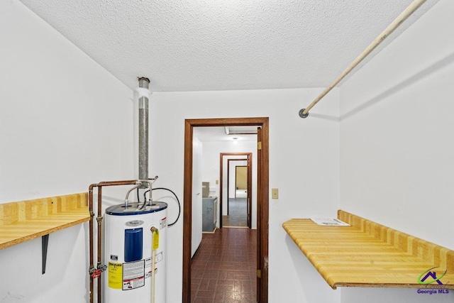 utility room featuring water heater