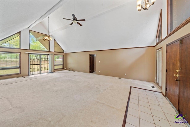 unfurnished living room with light carpet, high vaulted ceiling, and ceiling fan with notable chandelier