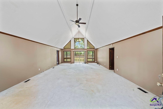 unfurnished living room with carpet, vaulted ceiling, and ceiling fan