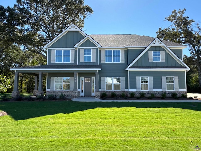 craftsman-style home featuring a front lawn