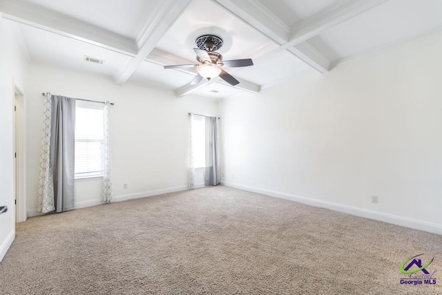 carpeted empty room with ceiling fan, beam ceiling, and coffered ceiling