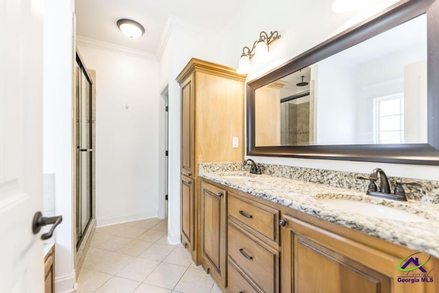 bathroom featuring vanity, ornamental molding, tile patterned floors, and walk in shower