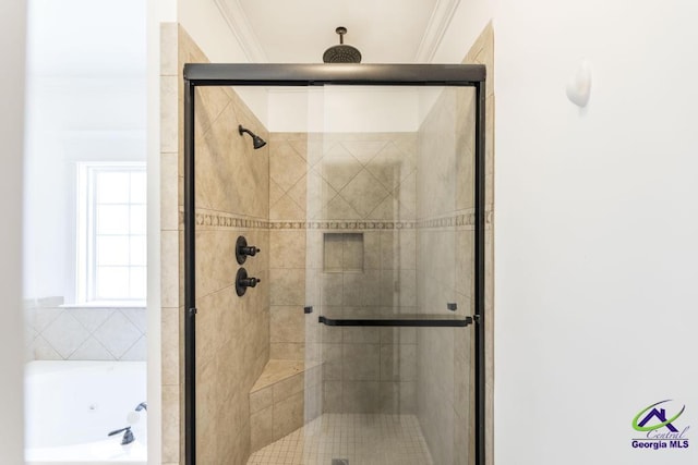 bathroom with ornamental molding and plus walk in shower