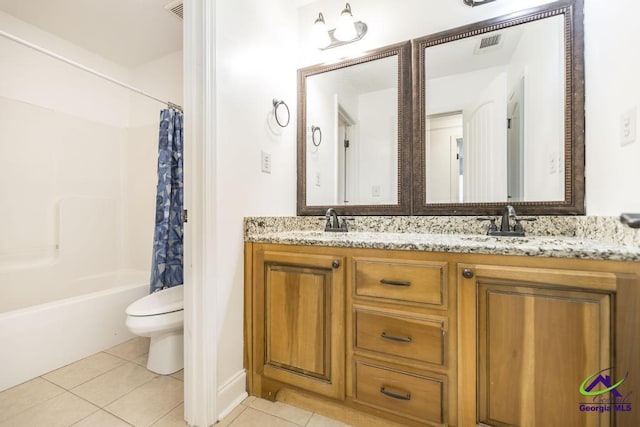 full bathroom with toilet, vanity, tile patterned flooring, and shower / tub combo