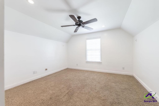 bonus room with lofted ceiling, ceiling fan, and carpet flooring