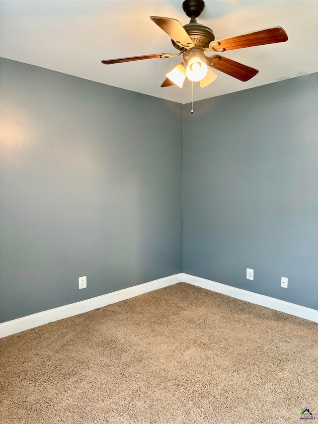 spare room featuring ceiling fan and carpet flooring