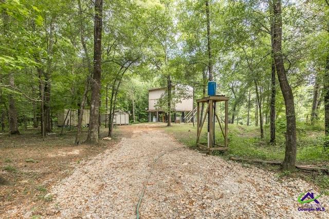 311 Riverside Dr, Hawkinsville, GA 31036 - view of street featuring gravel driveway