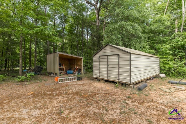 311 Riverside Dr, Hawkinsville, GA 31036 - view of shed with a wooded view