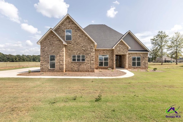 craftsman-style house with a front yard