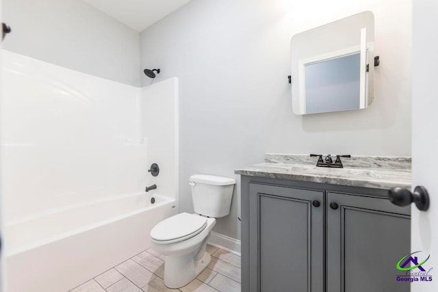 full bathroom with toilet, shower / bathing tub combination, vanity, and tile patterned flooring