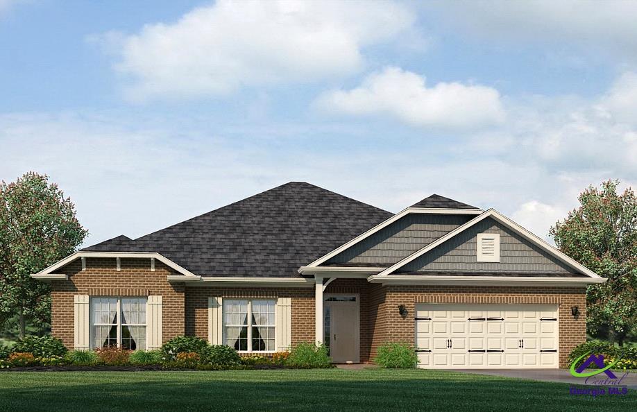 view of front of home with a garage and a front yard