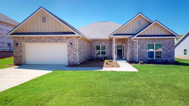 craftsman house with a front lawn and a garage