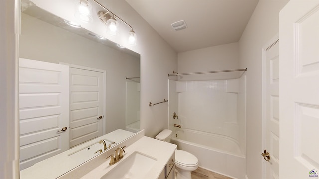 full bathroom featuring shower / bath combination, wood-type flooring, toilet, and vanity