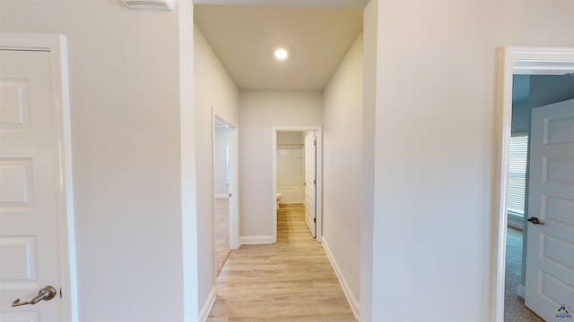 corridor featuring light hardwood / wood-style flooring