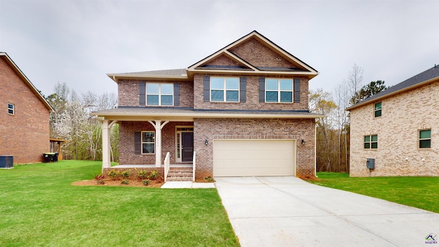 craftsman house with a garage, a front yard, a porch, and central AC