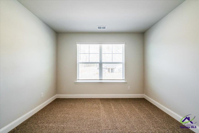 219 Carsons Walk, Macon, GA 31216 - unfurnished room with dark carpet, visible vents, and baseboards