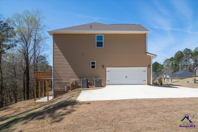 219 Carsons Walk, Macon, GA 31216 - view of property exterior featuring a lawn, driveway, central air condition unit, and an attached garage