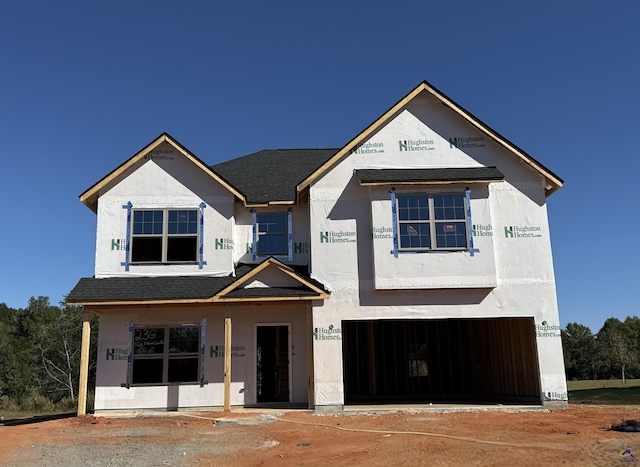 unfinished property with a garage