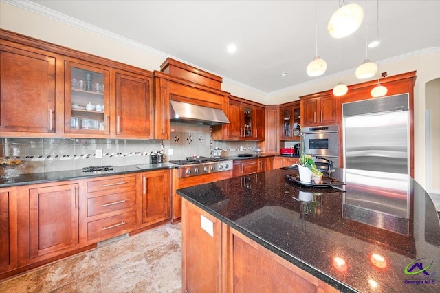 kitchen featuring wall chimney range hood, light tile flooring, backsplash, hanging light fixtures, and appliances with stainless steel finishes