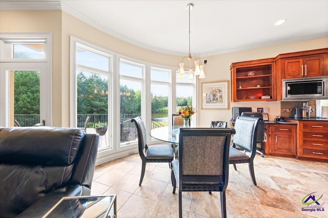 tiled dining area featuring a wealth of natural light, a chandelier, and crown molding