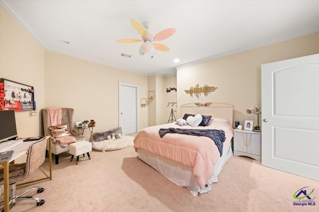 carpeted bedroom with ceiling fan and ornamental molding