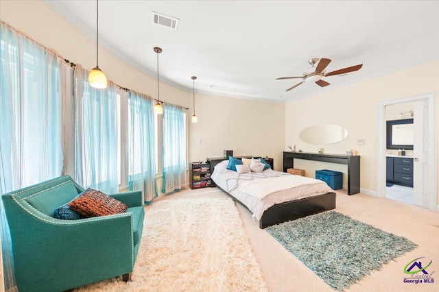 bedroom with carpet, ceiling fan, and crown molding