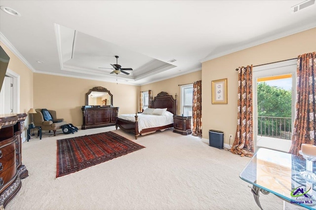 bedroom featuring crown molding, access to outside, a tray ceiling, carpet, and ceiling fan