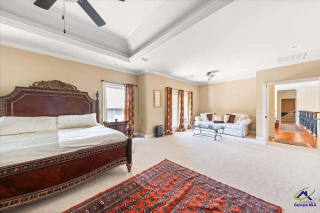 bedroom with ceiling fan, ornamental molding, and carpet floors