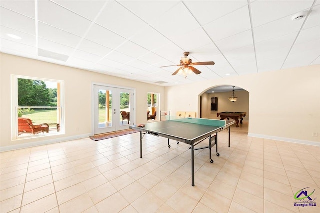 recreation room with light tile flooring, ceiling fan, a drop ceiling, pool table, and french doors