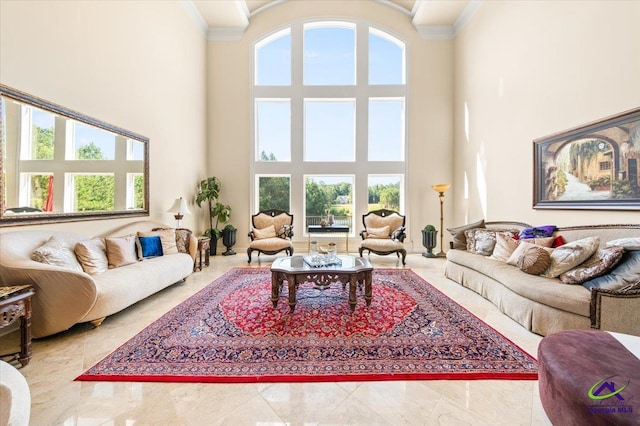 living room with tile flooring, a high ceiling, and ornamental molding