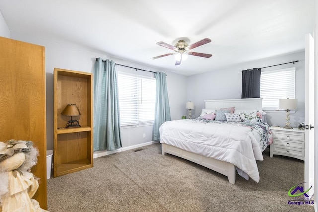 bedroom with ceiling fan and carpet