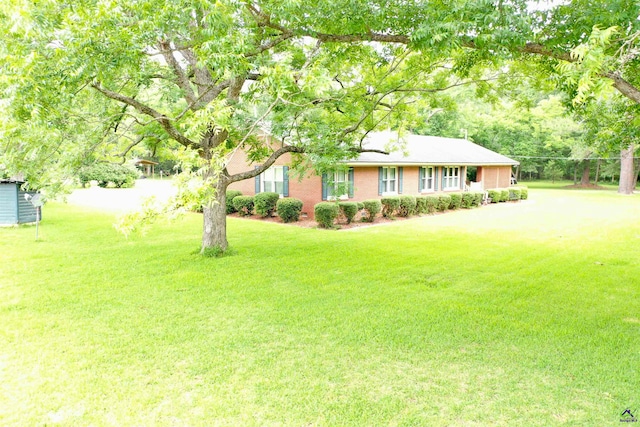 ranch-style home with a front lawn