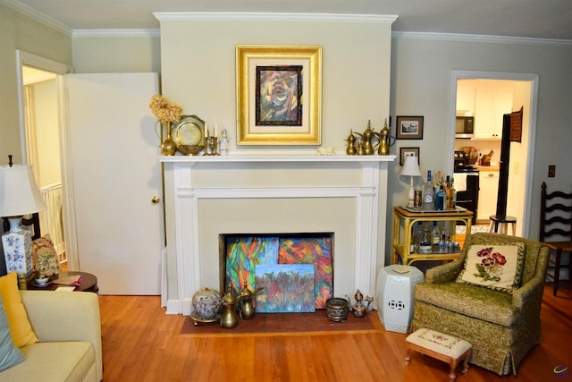 living room featuring ornamental molding and hardwood / wood-style flooring