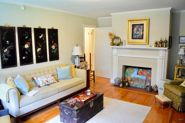 living room with crown molding and hardwood / wood-style floors