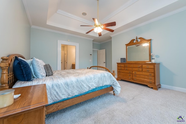 carpeted bedroom with ceiling fan, a raised ceiling, and ornamental molding